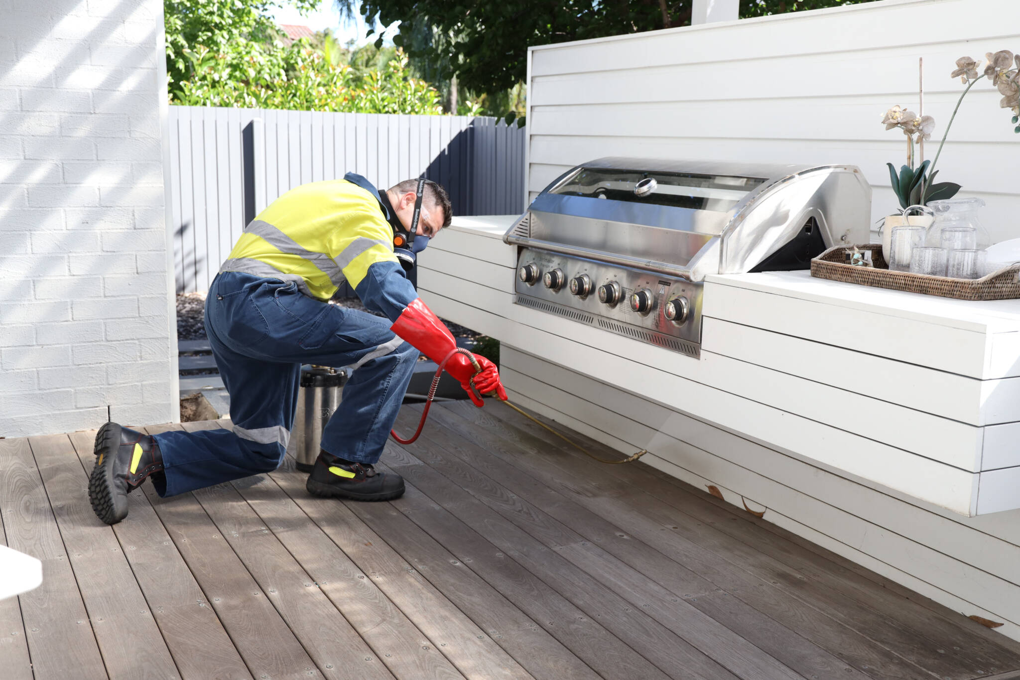 Chinchilla - technician spraying for spiders outdoors