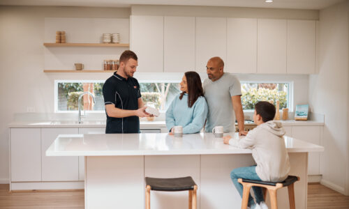 Flick technician explaining Flick's home protection plans to homeowners