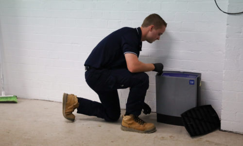 Installing SMART DIgital Pest Control at commercial property in Gosford